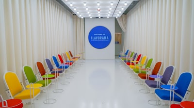a room with chairs and a screen